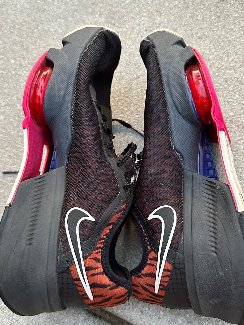 Nike Women's Black Mesh Athletic Shoes with Pink and Red Accents